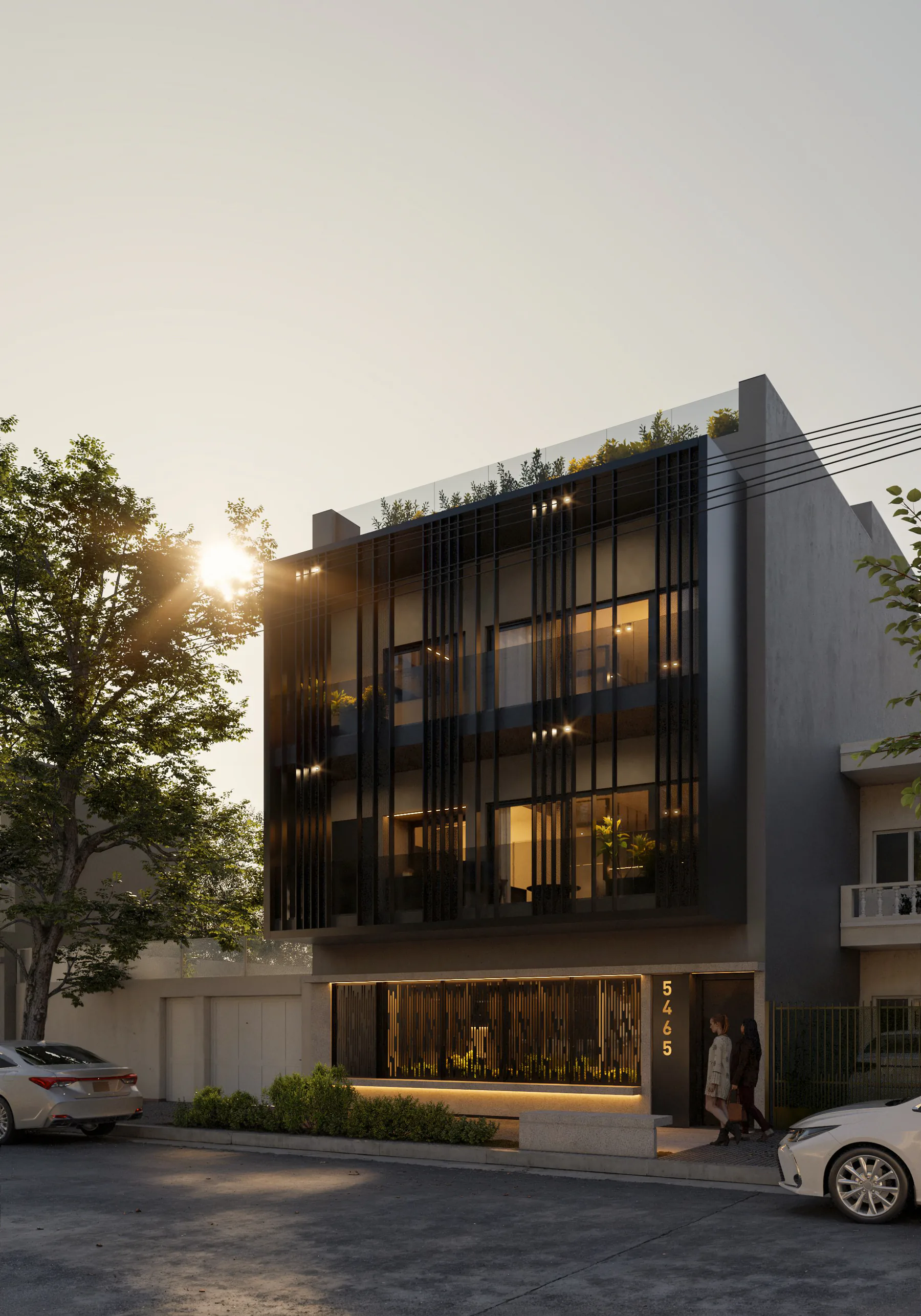 Fachada de José Luis Cantilo 5465 al atardecer, con la planta baja iluminada